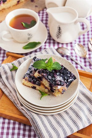 simsearch:400-07295671,k - Portion of fresh homemade blueberry cake and cup of tea on the background Photographie de stock - Aubaine LD & Abonnement, Code: 400-07485796