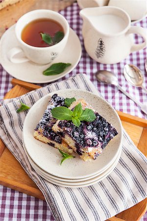 simsearch:400-07295671,k - Portion of fresh homemade blueberry cake and cup of tea on the background Photographie de stock - Aubaine LD & Abonnement, Code: 400-07485798
