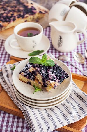 simsearch:400-07295671,k - Portion of fresh homemade blueberry cake and cup of tea on the background Photographie de stock - Aubaine LD & Abonnement, Code: 400-07485801