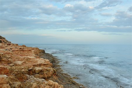 Rocky coast on sunset on a cloudy evening, Costa Blanca, Spain Stock Photo - Budget Royalty-Free & Subscription, Code: 400-07485992