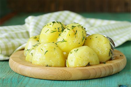 boiled fresh organic potatoes with the oil and dill Stock Photo - Budget Royalty-Free & Subscription, Code: 400-07486343