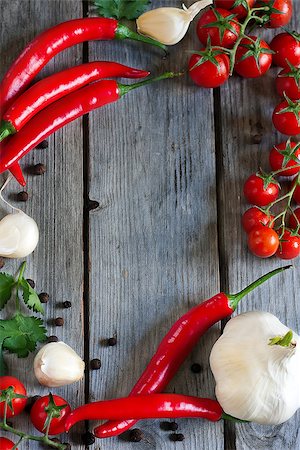 simsearch:695-05773492,k - Chili pepper, cherry tomato, cilantro and garlic - traditional ingredients of mexican cuisine. Copyspace background. Fotografie stock - Microstock e Abbonamento, Codice: 400-07486419