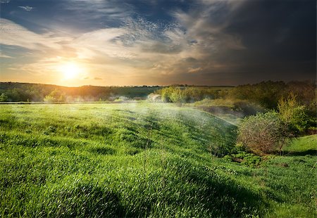 simsearch:400-06867510,k - Storm clouds at sunset over the spring field Stock Photo - Budget Royalty-Free & Subscription, Code: 400-07486786
