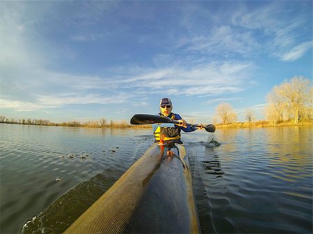 simsearch:400-07795226,k - senior male paddler enjoys workout in a racing kayak in sunset light on a calm lake in Colorado Foto de stock - Royalty-Free Super Valor e Assinatura, Número: 400-07481155