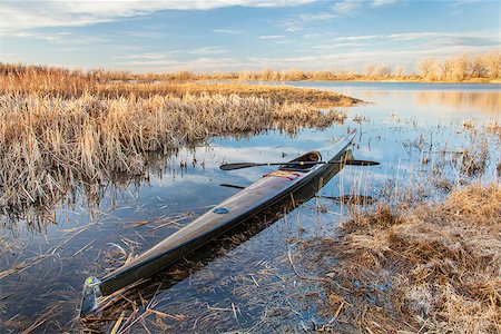 simsearch:400-07176700,k - slim carbon fiber racing sea kayak ready for paddling on a calm lake in Colorado, early spring Foto de stock - Super Valor sin royalties y Suscripción, Código: 400-07481632