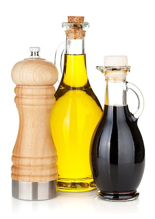 Olive oil and vinegar bottles with pepper shaker. Isolated on white background Stock Photo - Budget Royalty-Free & Subscription, Code: 400-07481646