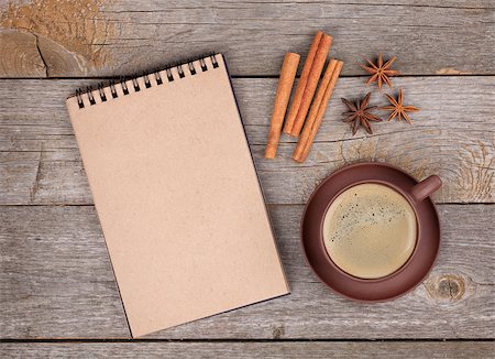 simsearch:400-07299272,k - Blank notepad for copy space with coffee cup and spices on wooden table Fotografie stock - Microstock e Abbonamento, Codice: 400-07481670
