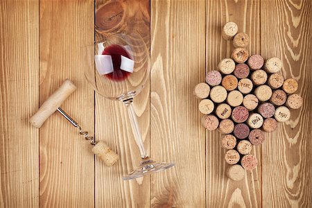 stopper - Red wine glass, corkscrew and grape shaped corks on wooden table background Stock Photo - Budget Royalty-Free & Subscription, Code: 400-07481773