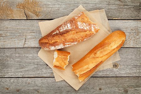 French bread over wooden table background Stock Photo - Budget Royalty-Free & Subscription, Code: 400-07481807