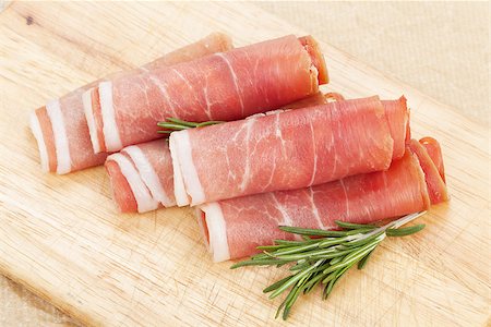 simsearch:400-07481817,k - Prosciutto with herbs on cutting board Stock Photo - Budget Royalty-Free & Subscription, Code: 400-07481816