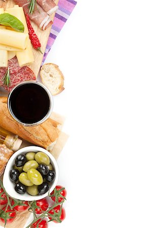 simsearch:400-07481817,k - Red wine with cheese, prosciutto, bread, vegetables and spices. Isolated on white background with copy space Stock Photo - Budget Royalty-Free & Subscription, Code: 400-07481824