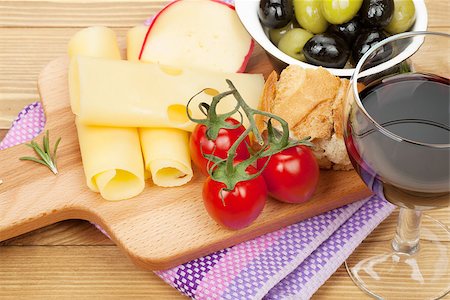 simsearch:400-07481818,k - Red wine with cheese, olives, bread, vegetables and spices on wooden table Foto de stock - Super Valor sin royalties y Suscripción, Código: 400-07481829