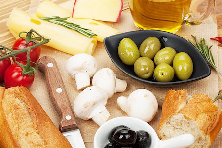 simsearch:400-07481817,k - Olives, mushrooms, bread, vegetables and spices over cooking paper Stock Photo - Budget Royalty-Free & Subscription, Code: 400-07481832