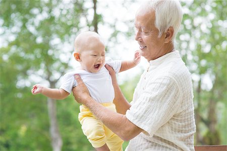 simsearch:400-04374126,k - Happy Asian Chinese grandpa and grandson having fun at outdoor garden. Foto de stock - Super Valor sin royalties y Suscripción, Código: 400-07482327