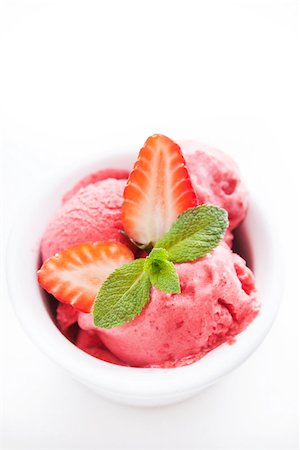 strawberry sorbet - Strawberry ice cream decorated with fresh berries and mint on white background Stock Photo - Budget Royalty-Free & Subscription, Code: 400-07482320