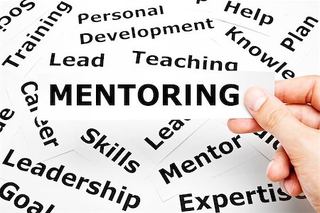 simsearch:400-08998421,k - Hand holding a piece of paper with the word Mentoring on it. Stockbilder - Microstock & Abonnement, Bildnummer: 400-07482587