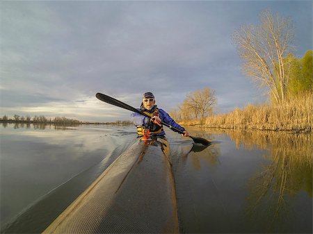 simsearch:400-07795226,k - senior male paddler enjoys morning workout in a slim racing kayak on a calm lake in Colorado Foto de stock - Royalty-Free Super Valor e Assinatura, Número: 400-07482593