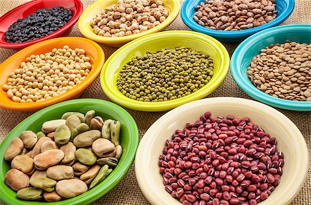 variety of legumes (fava bean, mung bean, soy, green lentils, adzuki, black, pinto, chickpea) in colorful ceramic bowls on canvas Photographie de stock - Aubaine LD & Abonnement, Code: 400-07482739