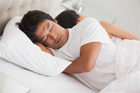simsearch:400-07483522,k - Couple sleeping in bed at home in bedroom Stock Photo - Budget Royalty-Free & Subscription, Code: 400-07483058
