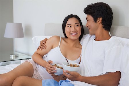 simsearch:400-07483522,k - Happy couple having breakfast in bed at home in bedroom Stock Photo - Budget Royalty-Free & Subscription, Code: 400-07483128