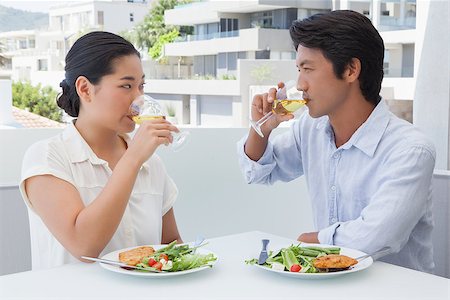 simsearch:400-07483384,k - Happy couple having a meal together with white wine outside on a balcony Stock Photo - Budget Royalty-Free & Subscription, Code: 400-07483166