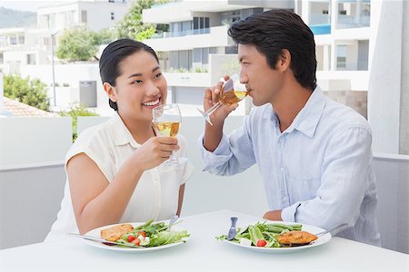 people and balcony and apartment - Happy couple having a meal together with white wine outside on a balcony Stock Photo - Budget Royalty-Free & Subscription, Code: 400-07483167