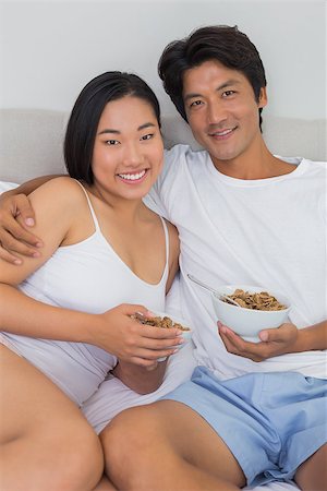 simsearch:400-07483522,k - Happy couple having breakfast in bed at home in bedroom Stock Photo - Budget Royalty-Free & Subscription, Code: 400-07483212