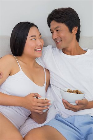 simsearch:400-07483522,k - Happy couple having breakfast in bed at home in bedroom Stock Photo - Budget Royalty-Free & Subscription, Code: 400-07483213