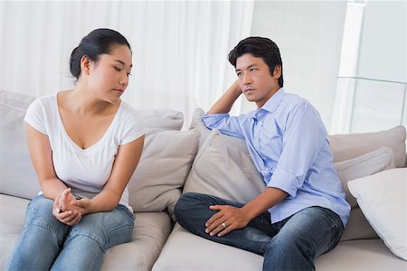 simsearch:400-07483384,k - Couple not talking after a dispute on the sofa at home in the living room Stock Photo - Budget Royalty-Free & Subscription, Code: 400-07483274