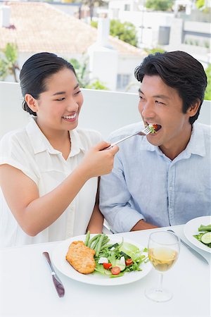 simsearch:400-07483384,k - Happy couple having a meal together with white wine outside on a balcony Stock Photo - Budget Royalty-Free & Subscription, Code: 400-07483343