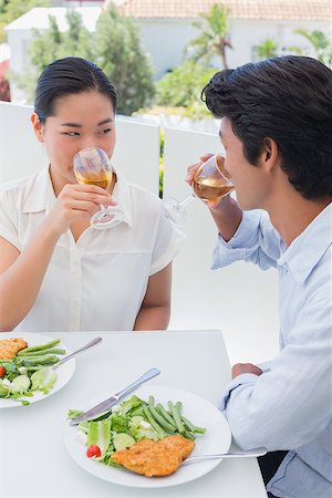 simsearch:400-07483384,k - Happy couple having a meal together with white wine outside on a balcony Stock Photo - Budget Royalty-Free & Subscription, Code: 400-07483351