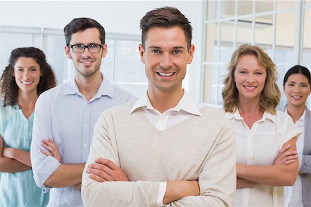 simsearch:400-07186359,k - Casual business team smiling at camera with arms crossed in the office Stock Photo - Budget Royalty-Free & Subscription, Code: 400-07483875