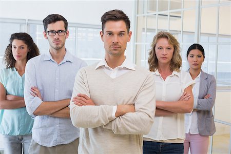 simsearch:400-07186359,k - Casual business team frowning at camera with arms crossed in the office Stock Photo - Budget Royalty-Free & Subscription, Code: 400-07483870