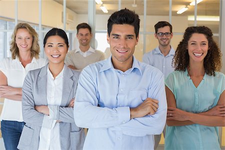 simsearch:400-07186359,k - Casual business team smiling at camera with arms crossed in the office Stock Photo - Budget Royalty-Free & Subscription, Code: 400-07483927