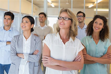 simsearch:400-07186359,k - Casual business team smiling with arms crossed looking up in the office Stock Photo - Budget Royalty-Free & Subscription, Code: 400-07483932