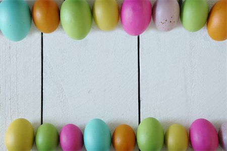 Spring or Easter Themed Background of Old Wood and Colored Eggs Lined Up Fotografie stock - Microstock e Abbonamento, Codice: 400-07498182