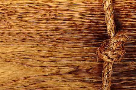 simsearch:400-06106317,k - Brown hemp rope on old wooden background Photographie de stock - Aubaine LD & Abonnement, Code: 400-07505584