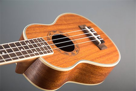 simsearch:400-07505739,k - Close-up shot of classic ukulele guitar, selective focus on pattern Stock Photo - Budget Royalty-Free & Subscription, Code: 400-07505740