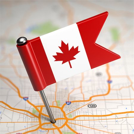 flag canada - Small Flag of Canada on a Map Background with Selective Focus. Stock Photo - Budget Royalty-Free & Subscription, Code: 400-07506155