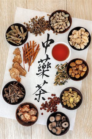 Chinese herbal tea calligraphy script on rice paper with herb selection and cup over light oak wood. Stock Photo - Budget Royalty-Free & Subscription, Code: 400-07506913
