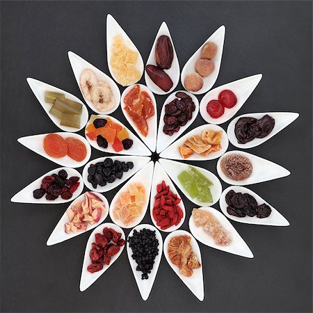 Dried fruit selection in white dishes over slate background. Photographie de stock - Aubaine LD & Abonnement, Code: 400-07506990