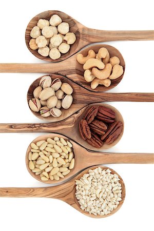 simsearch:400-09080000,k - Nut varieties of hazelnut, cashew, pistachio, pecan, pine kernel and chopped almonds in olive wood spoons over white background. Top to bottom. Stock Photo - Budget Royalty-Free & Subscription, Code: 400-07507355