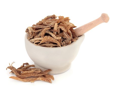 simsearch:400-06521200,k - Stemona root chinese herbal medicine in a stone mortar with pestle over white background. Bai bu. Stockbilder - Microstock & Abonnement, Bildnummer: 400-07507640