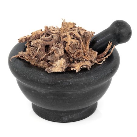 simsearch:400-07174356,k - Lovage ligusticum root herb chinese herbal medicine in a black stone mortar with pestle over white background. Gao ben. Stock Photo - Budget Royalty-Free & Subscription, Code: 400-07507641