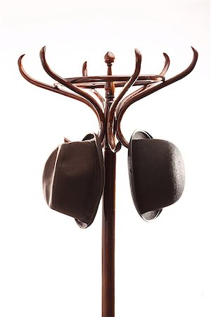 Bowler hats hangs on vintage wooden coat rack over white Stock Photo - Budget Royalty-Free & Subscription, Code: 400-07508544