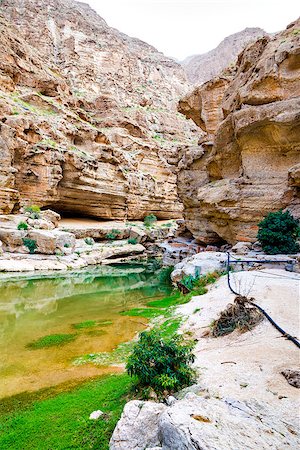 simsearch:862-05999703,k - Image of Wadi Shab in Oman with river,  rocks and palms Stock Photo - Budget Royalty-Free & Subscription, Code: 400-07508946