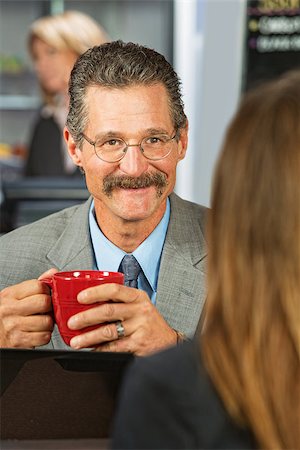 simsearch:400-07553657,k - Happy businessman with coffee talking with woman Stockbilder - Microstock & Abonnement, Bildnummer: 400-07509264