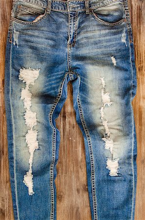 Detail of nice vintage weathered jeans on wood texture Foto de stock - Super Valor sin royalties y Suscripción, Código: 400-07509316