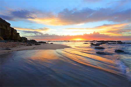 simsearch:400-07667033,k - Beautiful and colourful sunrise at the beach and vibrant  reflections in the ocean waters Stock Photo - Budget Royalty-Free & Subscription, Code: 400-07509485