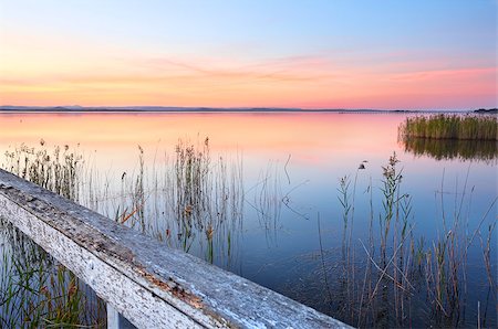 simsearch:400-07514503,k - Vivid and colourful sunset at Long Jetty and reflections on Tuggerah Lake NSW Australia. A beautiful place to unwind and relax Stock Photo - Budget Royalty-Free & Subscription, Code: 400-07509492